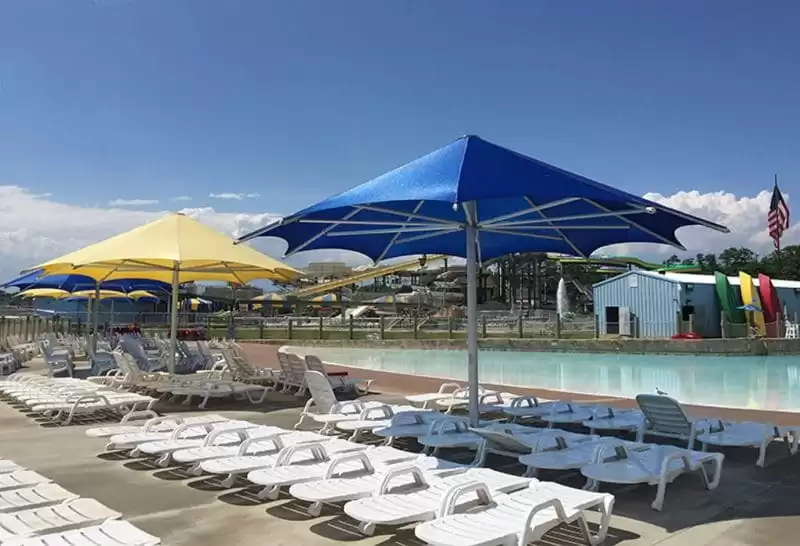 Anchor Industries poolside umbrellas and lounge chairs resort setting