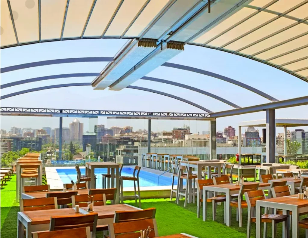 Outdoor dining area with retractable canopy roof.